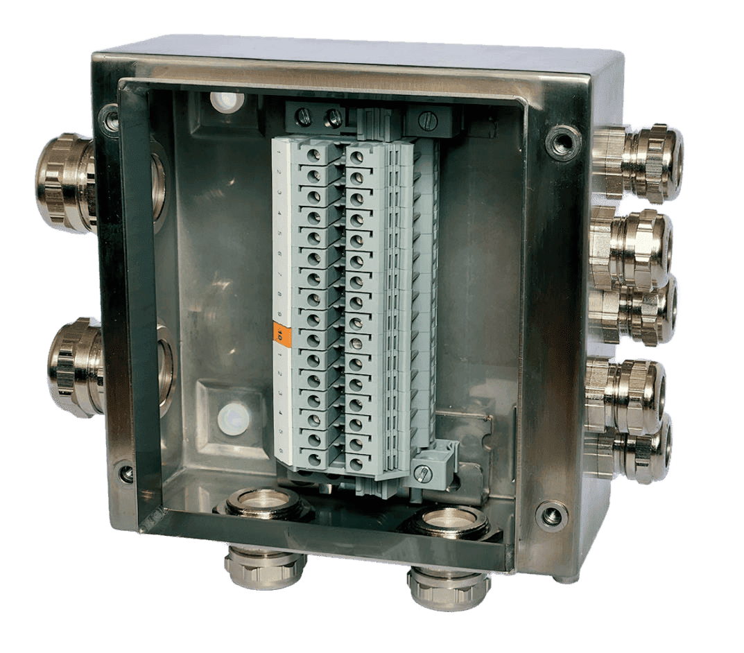 An open metallic electrical junction box with multiple cable glands and a terminal block inside